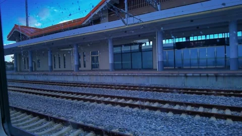 Enter the station, high speed rail, train, train station, rainy day 스톡 동영상 161063811