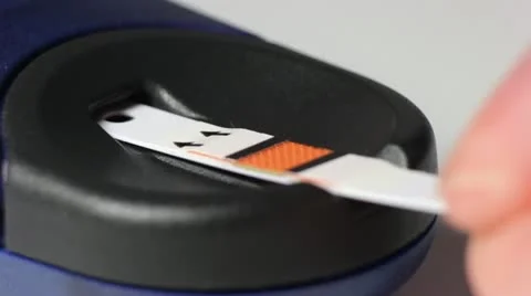 Enter a test strip Vídeos de archivo 11801073