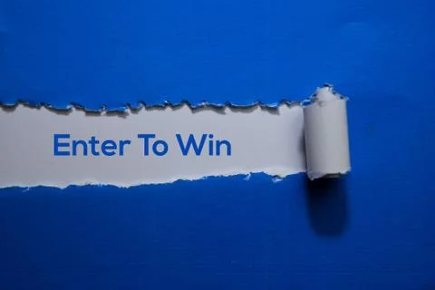 Enter To Win Text written in torn paper Foto stock
