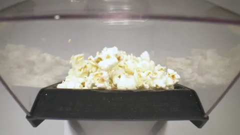 Entering an active popcorn machine. Stock Footage 130835871