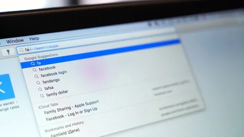 Entering adress of Facebook webpage on Apple Ipad display. Facebook is largest Stock Footage 80639902