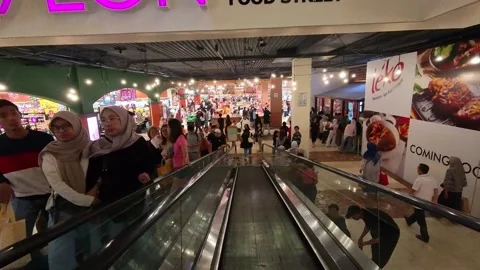 Entering AEON Retail in Paris Van Java Mall Stock Footage 332185923