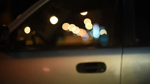 Entering car night (slide in) Stock Footage