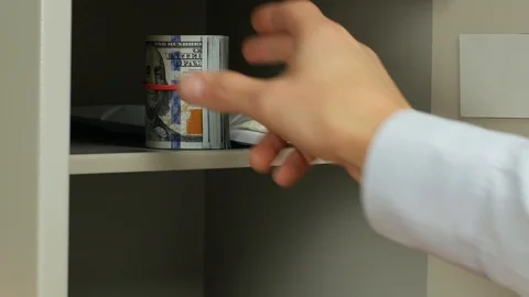 Entering a code, opening a safe and taking cash away Stock Footage 88602572
