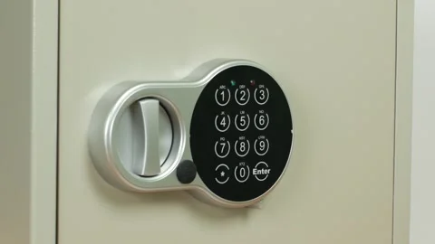 Entering a combination of numbers to open a safe and taking cash Stock Footage 292820064