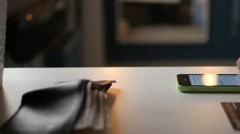 Entering credit card data for a payment using smartphone. Dolly shot Stock Footage 68991558