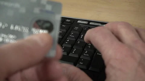 Entering a credit card number while shopping online Stock Footage 235941836