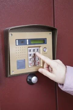 Entering door code or number of apartment, close up view Stock Photos