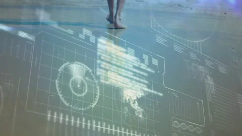 Entering frame with bare legs, stepping onto wet sand activating HUD charts Stock Footage 311083348