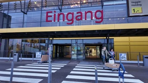 Entering german IKEA store, long sequence of entering a IKEA store from outside 動画素材 292674768