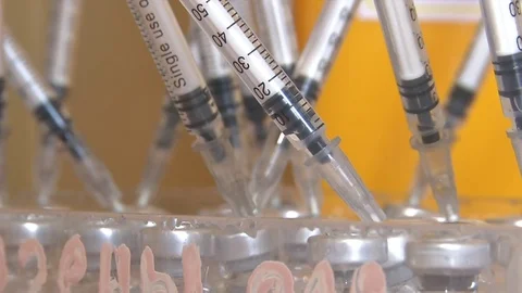 Entering the injection into a single-use syringe. 2 Shots. Видео 74245840