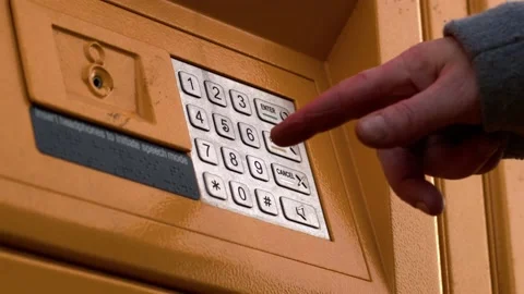 Entering key code in collection locker Stock Footage 229159434