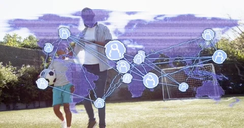 Entering left, dad guiding boy holding ball toward goal tech map overlay nodes Stock Footage 334185141