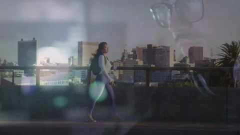Entering left, female walking rooftop railing, faint male overlays growing, Video stock 332566260