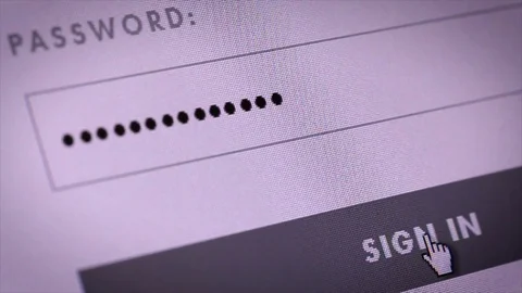 Entering password and clicking the button sign in on computer screen Stock Footage