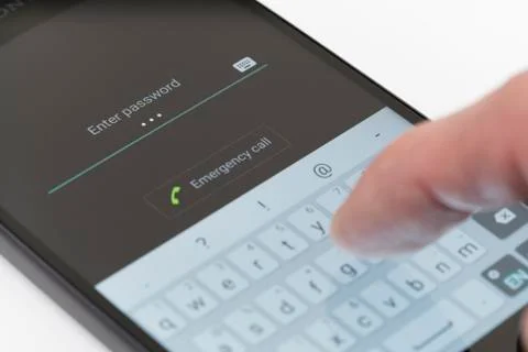 Entering password on Android phone Stock Photos
