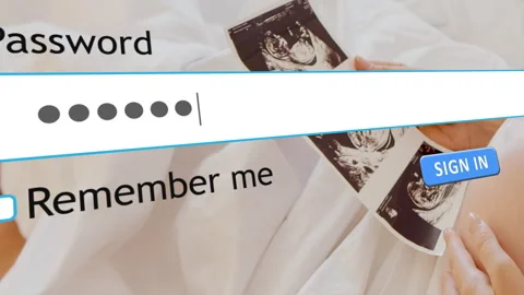 Entering password on website form with maternity image in the background 스톡 동영상 334022830