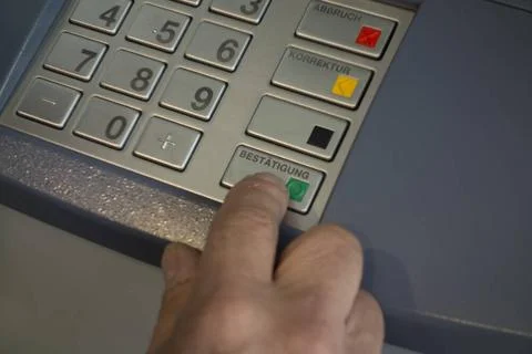 Entering the pin code at an ATM or cash machine entering pin code at an AT... Stock Photos