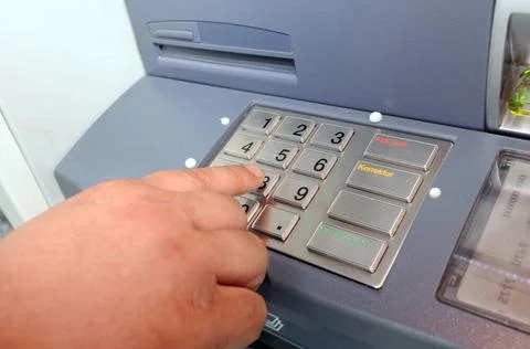 Entering the pin code at an ATM or cash machine entering pin code at an AT... Foto stock