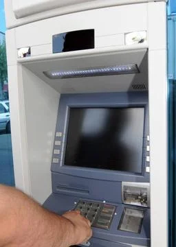 Entering the pin code at an ATM or cash machine entering pin code at an AT... Stock Photos