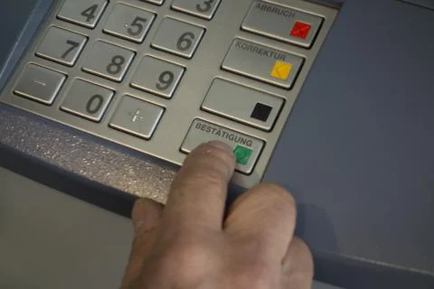 Entering pin code at an ATM Stock Photos