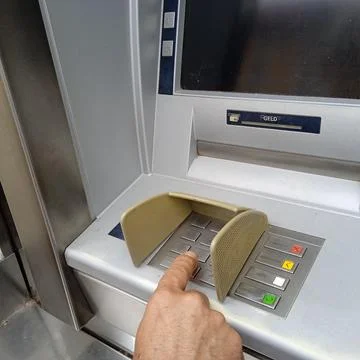 Entering pin code at an ATM Stock Photos