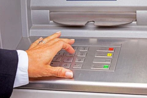 Entering pin code in the cash machine Fotos de archivo