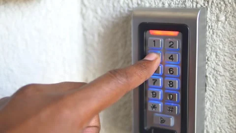 Entering a secure access code at a building entrance Stock Footage 314206718