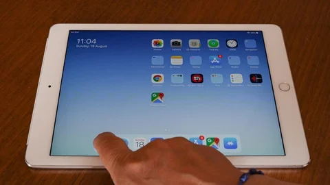 Entering Settings control panel on Apple Ipad Video stock 114370464