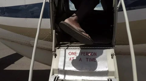 Entering a small plane Stock Footage 60389929