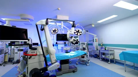Entering through the opened doors to a spacious well-equipped surgical room.  Видео 304442290