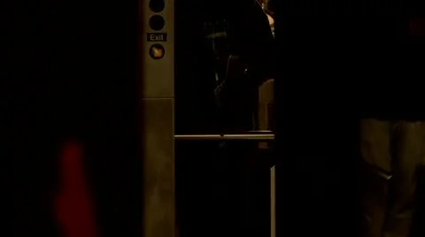 Entering through turnstile Stock Footage 22159690