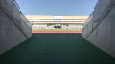 Entering Track And Field Stadium Stock Footage