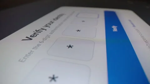 Entering two-factor authentication code for secure identity verification Stock Footage 340542930
