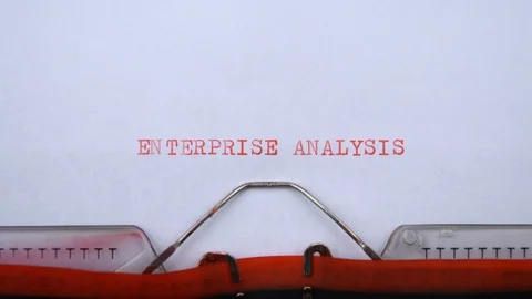 Enterprise analysis- phrase printed on an old typewriter in red letters, closeup Stock Footage 129535759