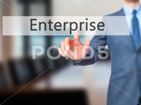 Enterprise - Businessman hand pressing button on touch screen in Stock Photos