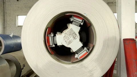 Enterprise. Metalworking and construction. Rolls of sheet metal for forming a Stock Footage 196930483