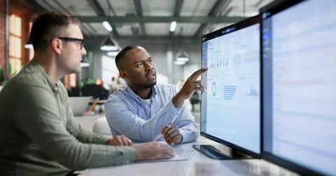 Enterprise Software Developers Collaborate To Design Cloud-based ERP Interfac Stock Photos