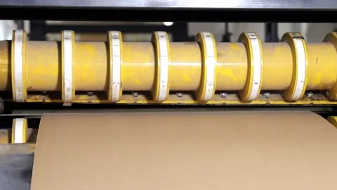 Enterprise. A special machine cuts pieces of paper with sharp knives. Printing Stock Footage 184565394