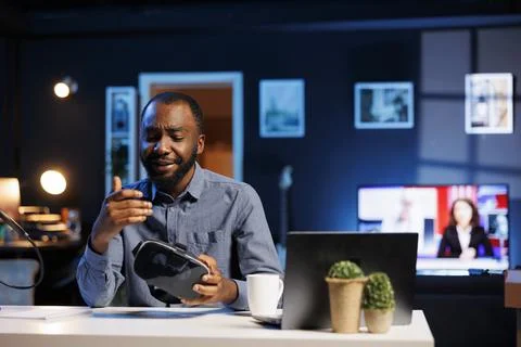 Entertainer presents VR goggles Stock Photos