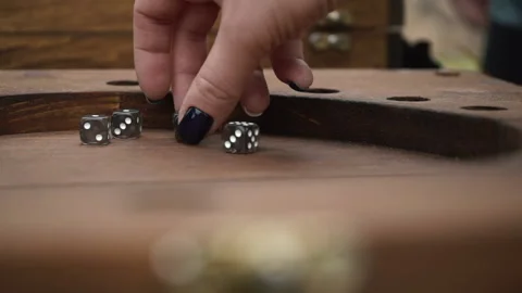 Entertainment Game Concept. A Hand Throws Two Dice on a Wooden Table. Stock Footage 199627096