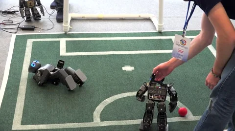 Entertainment mobile Robots playing soccer at the VII International IT Forum. Video stock 61934681