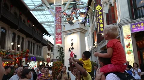 Entertainment representation using quadcopter in Chinatown, Singapore Stock Footage 48679329