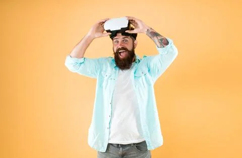 Entertainment. Testing software. Bearded man yellow background vr glasses Stock Photos