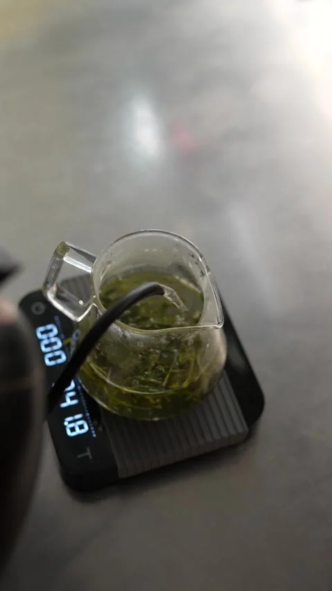 The enthralling process of brewing green tea at the dining place. Stock Footage 257035294