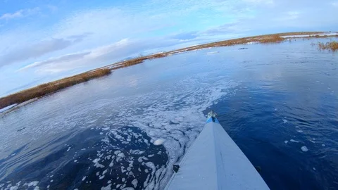 Enthusiast sails on single boat using paddle with two blades Stock Footage 123411060