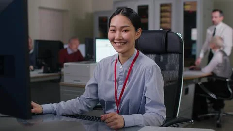 Enthusiastic asian it programmer working on desktop computer. Stock Photos