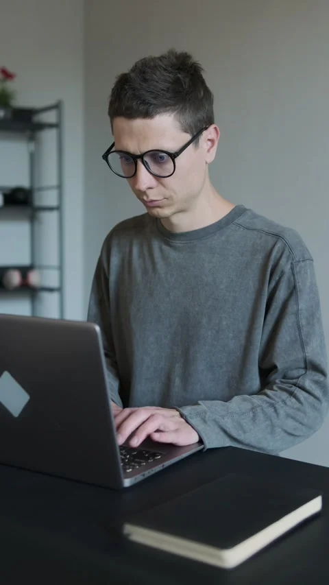 Enthusiastic attractive man using laptop and starting job home office. Stock Footage 308237590