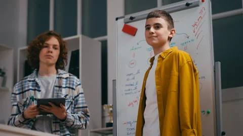 Enthusiastic boys classmates presenting ... | Stock Video | Pond5