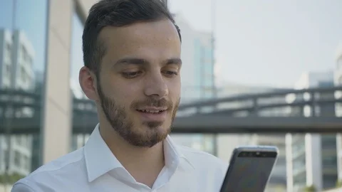 Enthusiastic Caucasian young manager checking text message Stock Footage 97915391
